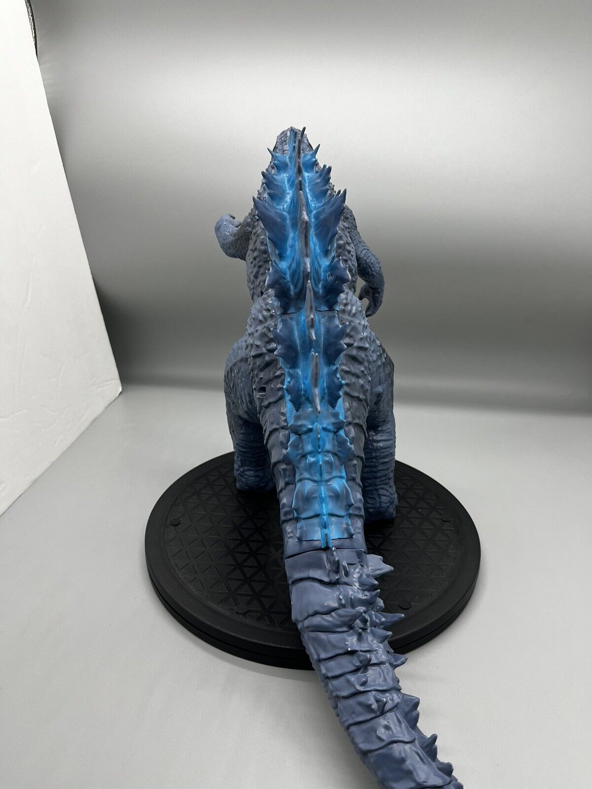 Godzilla figure, movable body parts, and blue flame back 22" x 12"