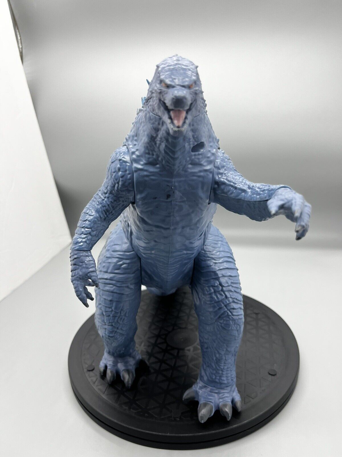 Godzilla figure, movable body parts, and blue flame back 22" x 12"