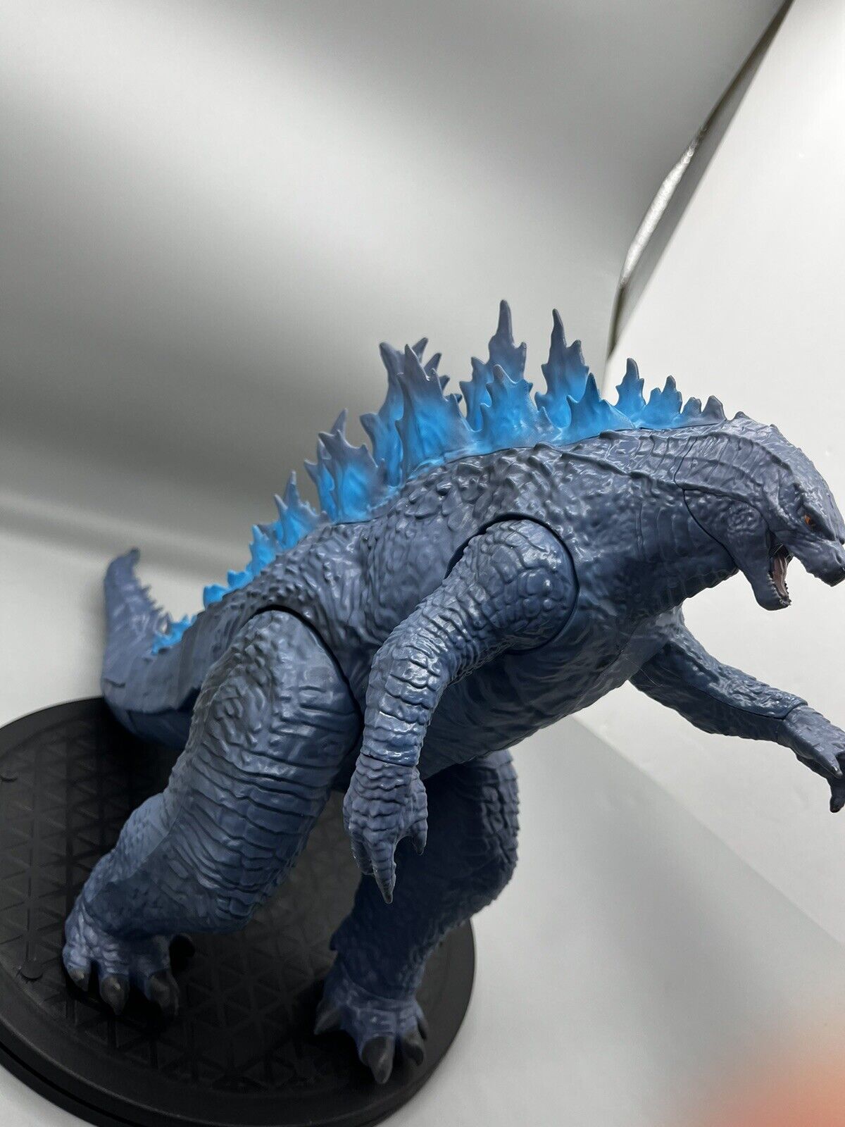 Godzilla figure, movable body parts, and blue flame back 22" x 12"