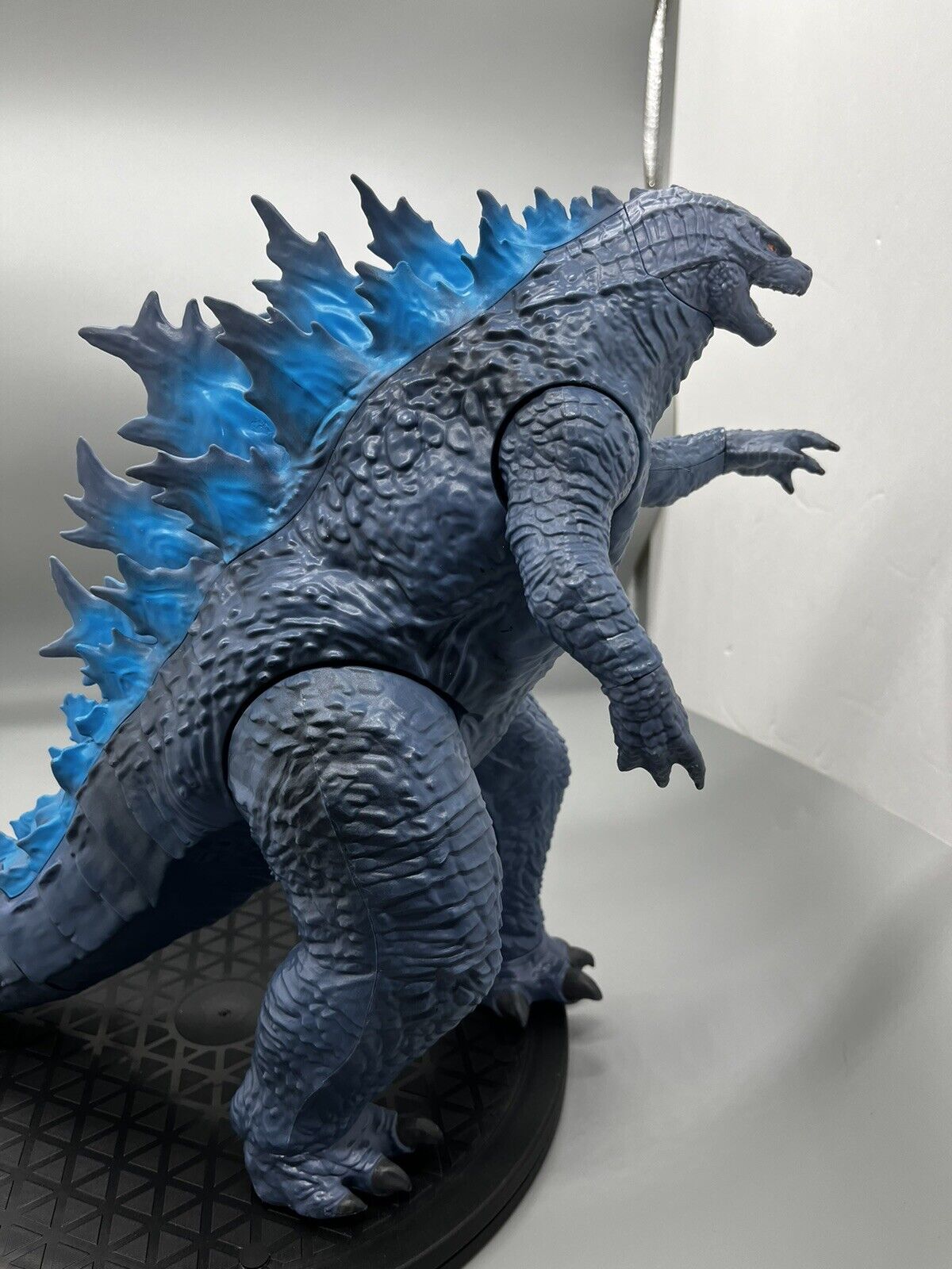 Godzilla figure, movable body parts, and blue flame back 22" x 12"