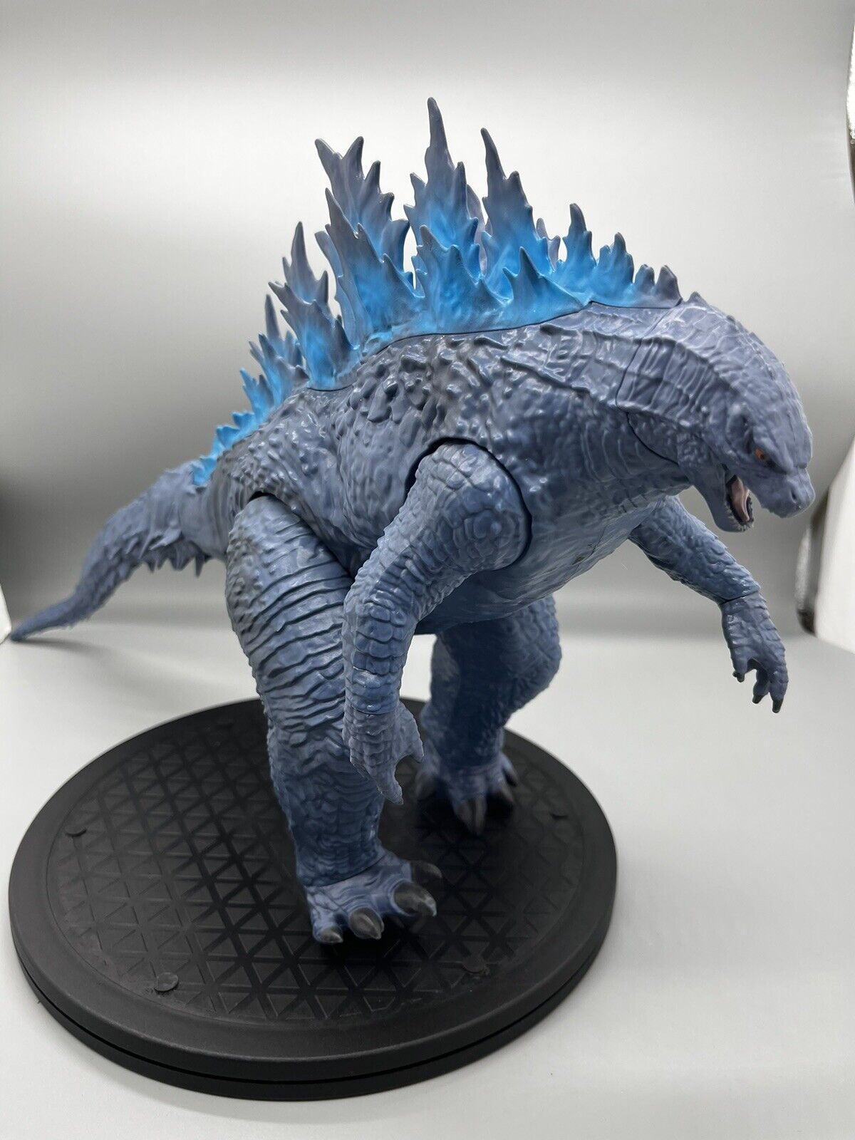 Godzilla figure, movable body parts, and blue flame back 22" x 12"