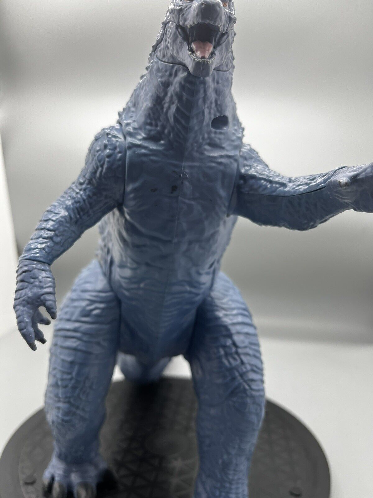 Godzilla figure, movable body parts, and blue flame back 22" x 12"