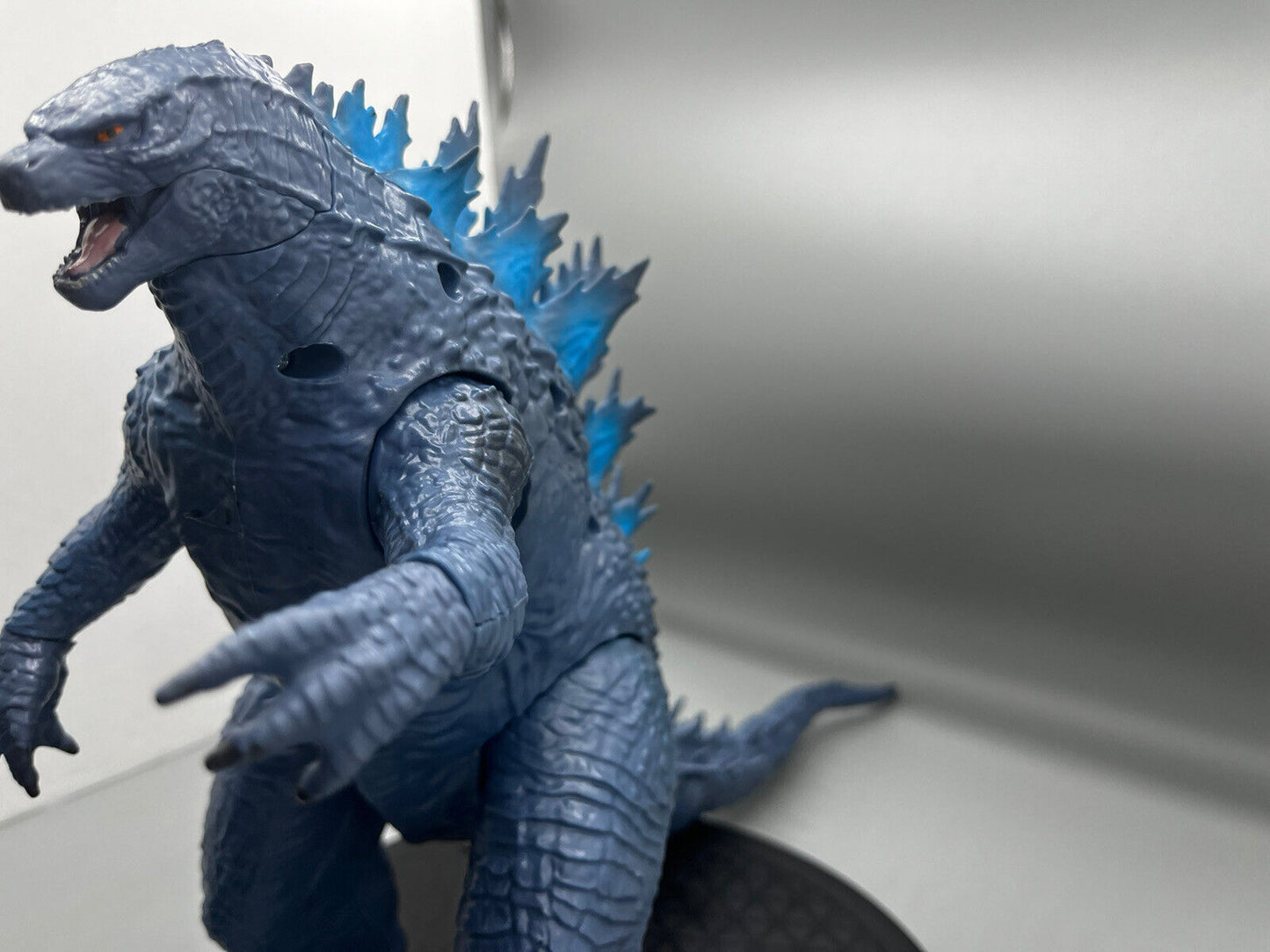 Godzilla figure, movable body parts, and blue flame back 22" x 12"