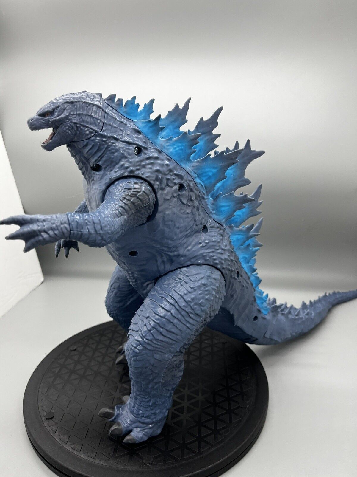 Godzilla figure, movable body parts, and blue flame back 22" x 12"